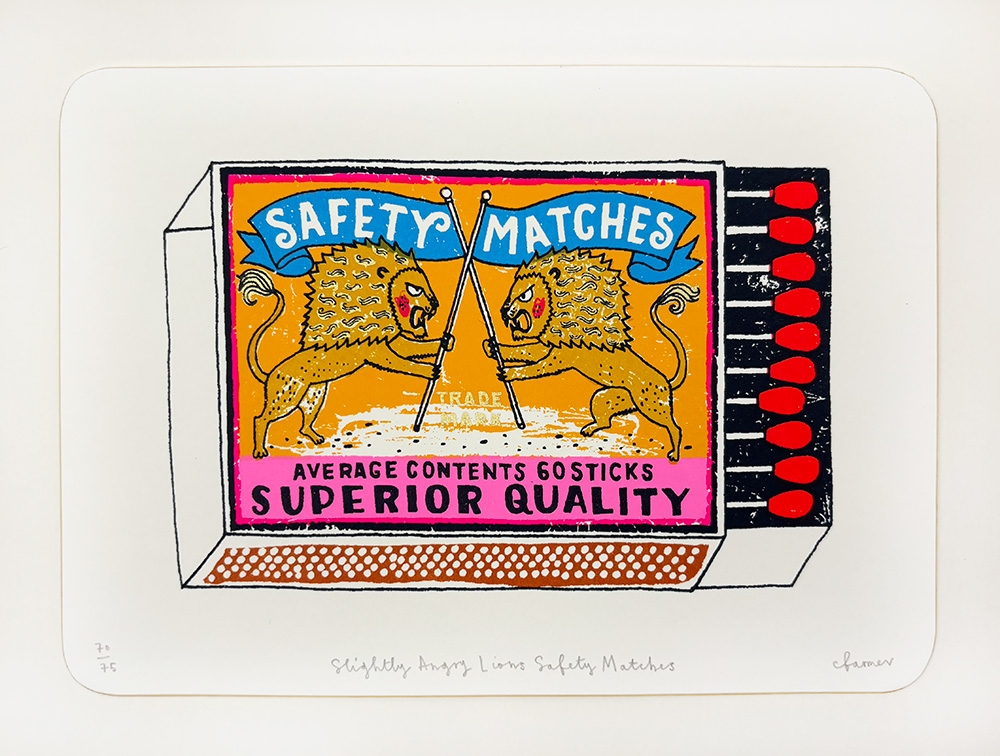 Limited Edition "Slightly Angry Lion Safety Matches" screen print featuring two lions with spears, "Safety Matches, Superior Quality" label, and red-tipped matches on the right side.