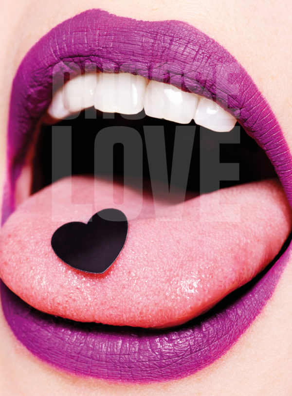 This artwork presents an intimate close-up of a mouth, where the lips are vividly painted with the bold, purple "CHOOSE LOVE - Rankin" lipstick. The words "CHOOSE LOVE" are elegantly emblazoned across them, capturing attention with their striking message. Adding a playful yet impactful element to this creation is a small black heart that rests delicately on the tongue, further enhancing the daring and expressive nature of this piece.