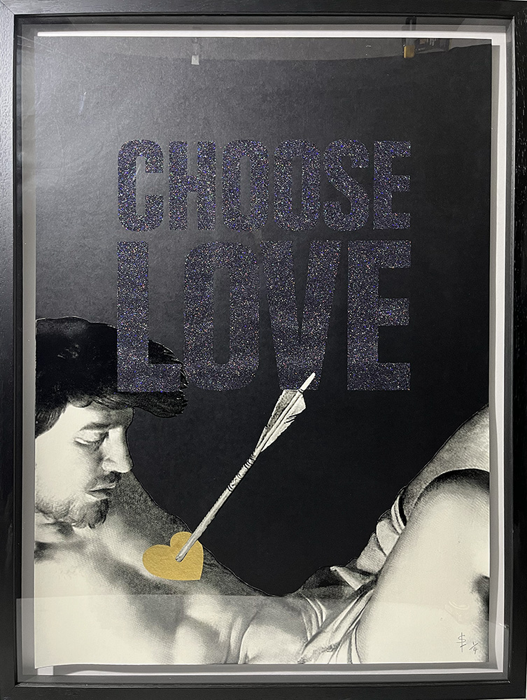 Screen print shows glittery “CHOOSE LOVE” text above a black and white man pierced by an arrow with a gold heart tip.
