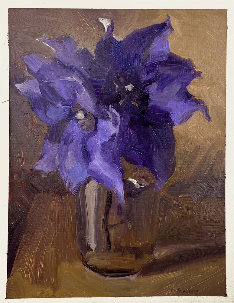 A portrayal of a Purple Clematis Flower nestled within a transparent glass vase, positioned gracefully on a wooden table. The background is awash with an array of warm, gentle tones that highlight the intricate texture and rich depth of the petals.