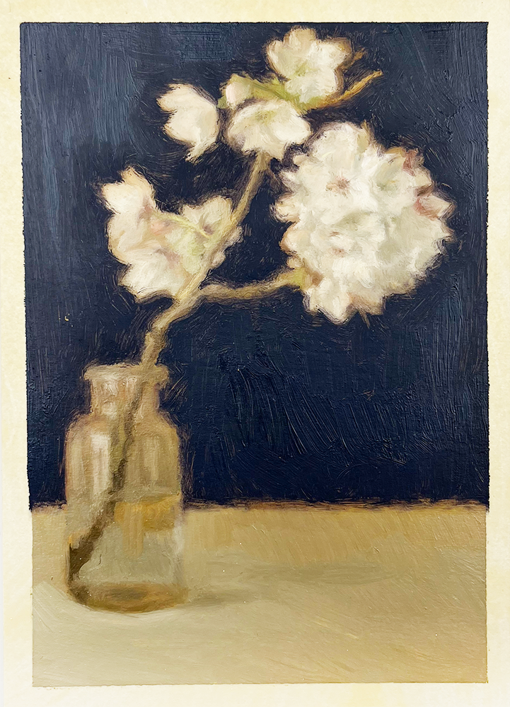 An artwork titled "Cherry Blossom" captures the tranquil beauty of a still life scene. Central to the composition is a delicate branch of white cherry blossoms, elegantly arranged in a petite glass vase. The blossoms, with their gentle hues, stand out against a rich dark blue background that enhances their ethereal quality. The light-colored table beneath them serves as a subtle foundation, contributing to the painting's soft and delicate ambiance.