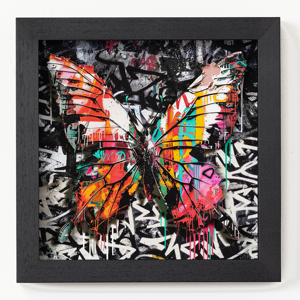 **Urban Butterfly No.4 (Small Framed Copy)**  Behold "Urban Butterfly No. 4"—an exquisite masterpiece that seamlessly fuses the delicate allure of nature with the vibrant energy of urban life. This piece features a butterfly whose wings are a spectacular kaleidoscope of orange, pink, blue, and green hues, radiating against a graffiti-inspired backdrop suffused in rich blacks and stark whites. The striking contrast between the vivacious colors of the butterfly and the monochromatic urban setting not only captivates but also speaks to themes of resilience and beauty amidst chaos.  Elegantly encapsulated within a sleek black frame, this work is both modern in its design and timeless in its appeal. Truly, it serves as a testament to the exceptional craftsmanship and boundless creativity of its artist.