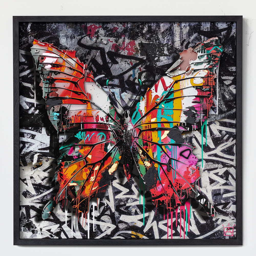 Presenting the exquisite "Urban Butterfly No.4 - LARGE FRAMED (Copy)," an arresting piece of graffiti wall art that seamlessly marries the realms of vibrant color and urban expression. This stunning creation meticulously depicts a multicolored butterfly, its wings splashed with bold hues of red, orange, pink, yellow, green, and blue. The butterfly emerges from a richly textured black and white abstract background that is expertly adorned with intricate patterns and dynamic paint drips.  The juxtaposition of the chaotic yet harmonious background against the vivid brilliance of the butterfly creates an evocative narrative about beauty amidst urban chaos. This large framed masterpiece not only serves as a testament to cutting-edge graffiti artistry but also stands as a compelling oeuvre that invites viewers to contemplate the delicate balance between natural wonder and metropolitan vibrancy.