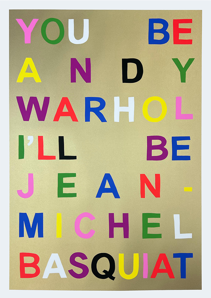 On a beige canvas, vibrant block letters spell out "YOU BE ANDY WARHOL I'LL BE JEAN-MICHEL BASQUIAT," capturing the essence of a limited edition screenprint one might discover in a chic gallery in Hackney.