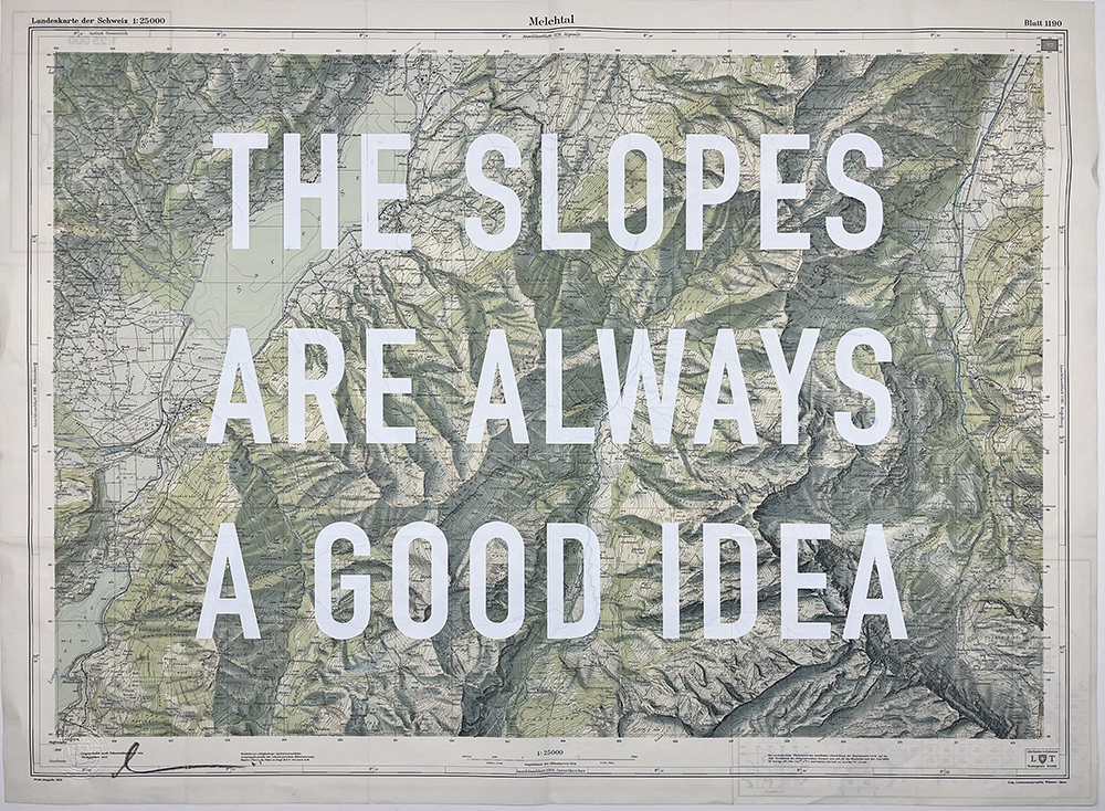 A vintage topographic map, rendered in soft greens and grays, serves as a captivating artistic backdrop. Bold white text playfully stretches across the map, proclaiming with enthusiasm, "The Slopes Are Always a Good Idea." This fusion of cartography and typography offers an inspiring homage to the exhilarating allure of skiing or adventurous mountain escapades.