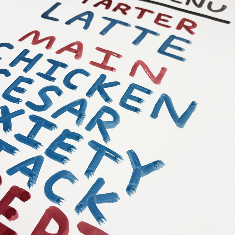 A creatively hand-drawn poster, titled “90’s Menu,” unfolds as a work of art. It colorfully presents a Latte as the introductory starter, followed by main courses such as Chicken Caesar Anxiety Attack, and concludes with indulgent desserts like Chocolate Fudge Pop-Tart Introspection. The entire menu is elegantly scripted in lively shades of red and blue, capturing the essence of the decade with vibrant flair.