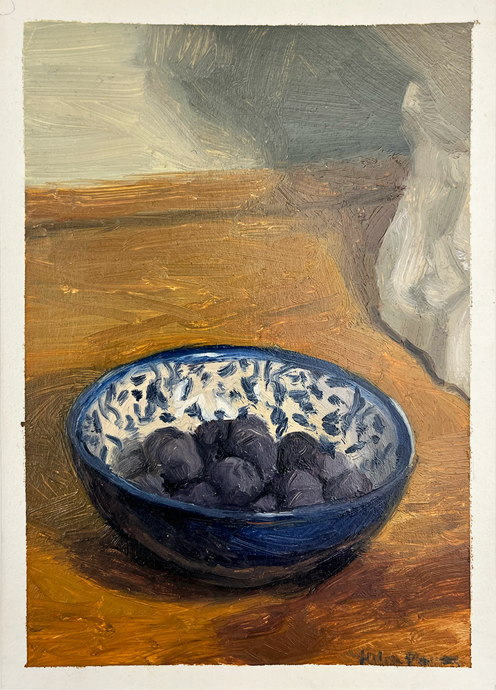 The painting "Blueberries in a Spanish Bowl" captures the beauty of simple objects. Round purple fruits, possibly plums, fill a blue and white Spanish bowl. A few blueberries mixed in create visual depth. Muted tones and soft textures suggest fabric draped softly in the background. The composition invites viewers to appreciate everyday elegance.