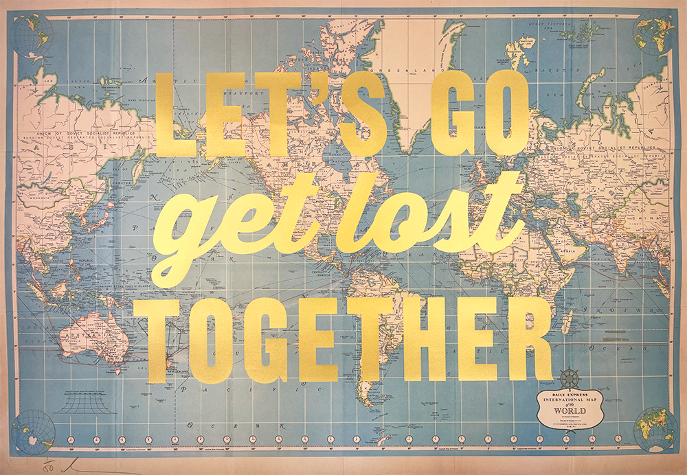 A world map with the words "LET'S GO get lost TOGETHER" in large yellow letters across the center.