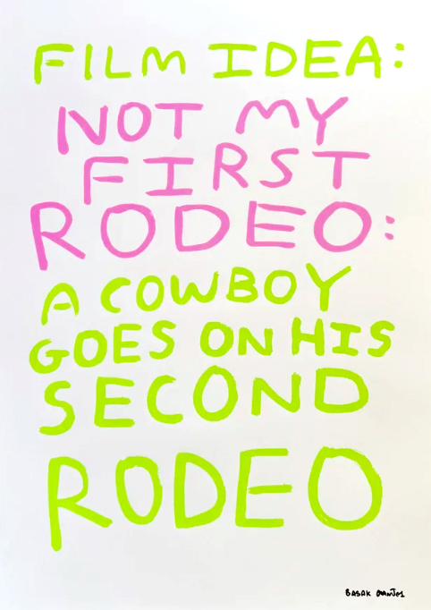 Text reads: "Film idea: Not my first rodeo: A cowboy goes on his second rodeo" in green and pink handwritten letters on a white background.