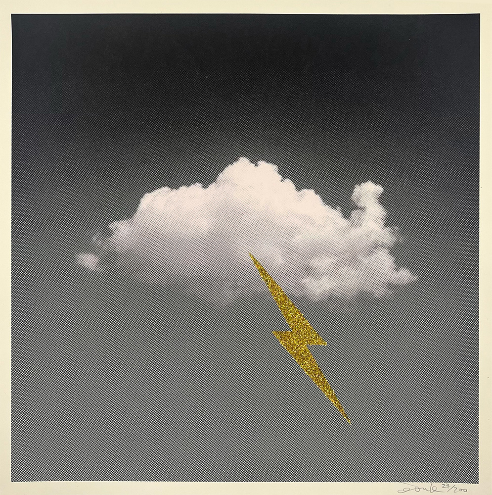 A single Little Fucking Cloud (Mini) - Gold Glitter features a white cloud with a gold glitter lightning bolt striking downward on a gray gradient background.