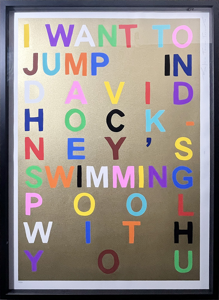 I Want To Jump In David Hockney's Swimming Pool With You (Gold) - Framed showcases bold multicoloured block letters on a gold background, making it a playful and vibrant statement piece for any room.