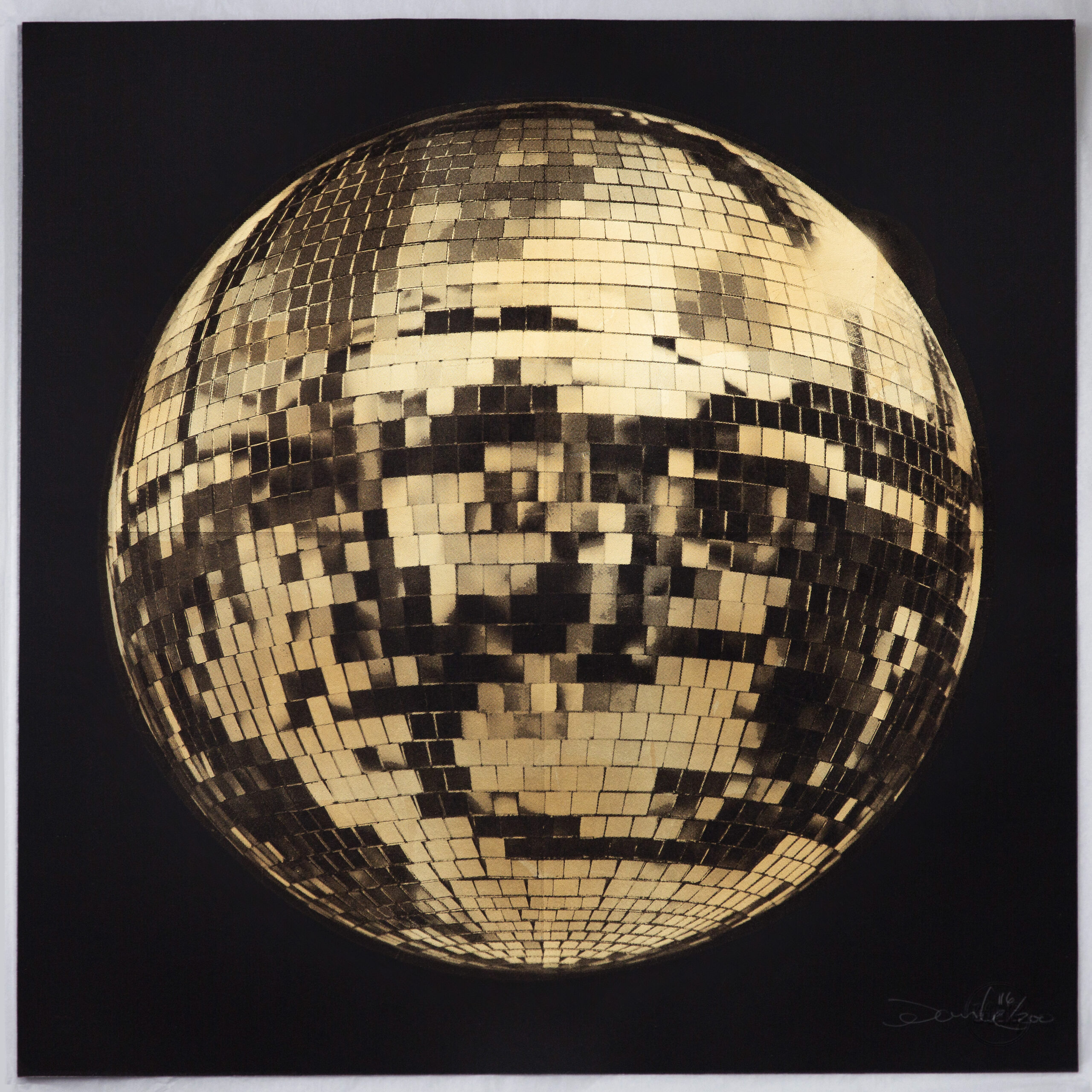Golden disco ball made of small square mirrors, reflecting light and shadows, set against a dark background.