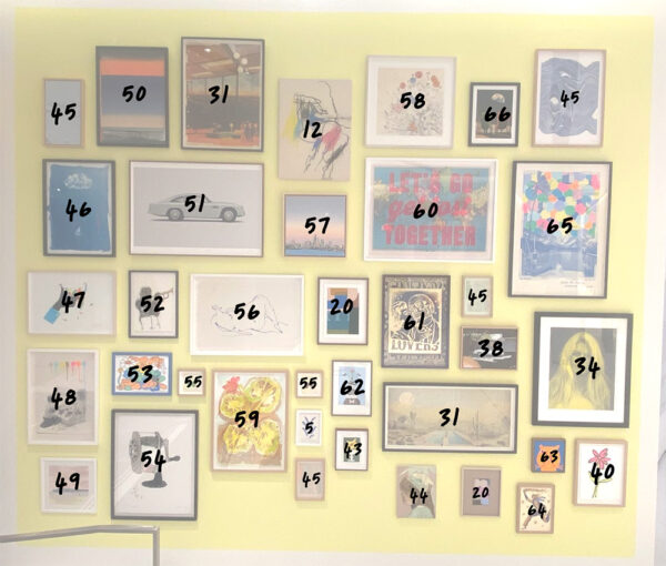 A wall showcases The Bishopsgate Collection art—28 framed artworks and photos arranged in a grid, each marked with a handwritten black number from 12 to 66.