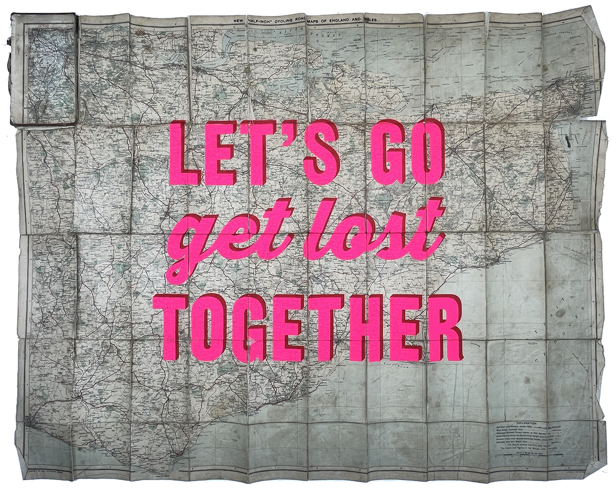 A 1953 map of Dublin with bold pink text “LET’S GO get lost TOGETHER” across the centre and gold leaf accents.