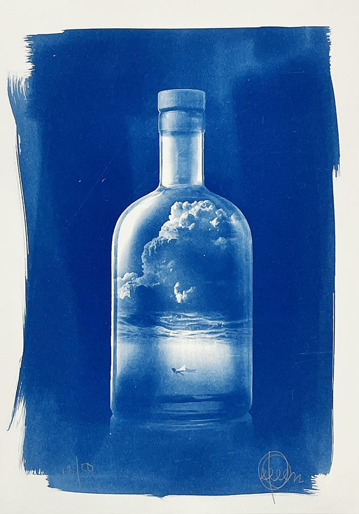Miniature artwork in blue tones shows a bottle with clouds and a small boat on water, set on a white background.