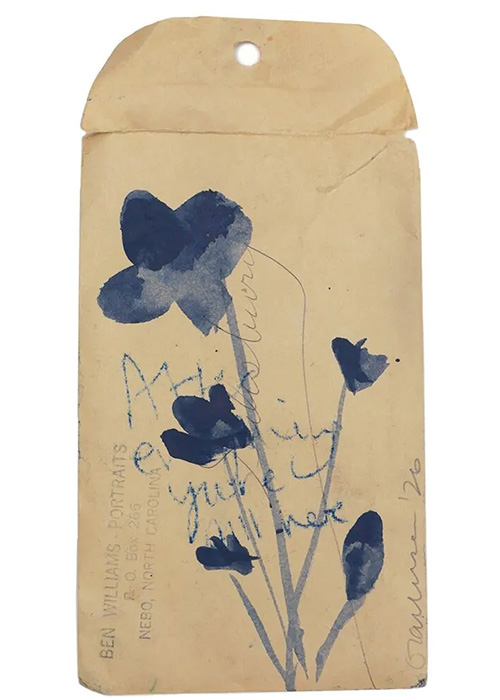 A beige envelope with blue watercolour flowers, handwritten text, and the words “BEN WILLIAMS: PORTRAITS” printed on the left side.